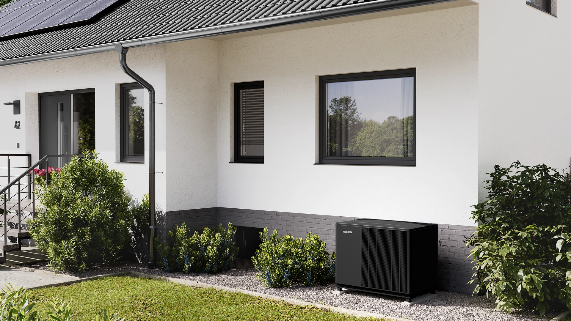 Modernes Wohnhaus mit Wärmepumpe im Garten